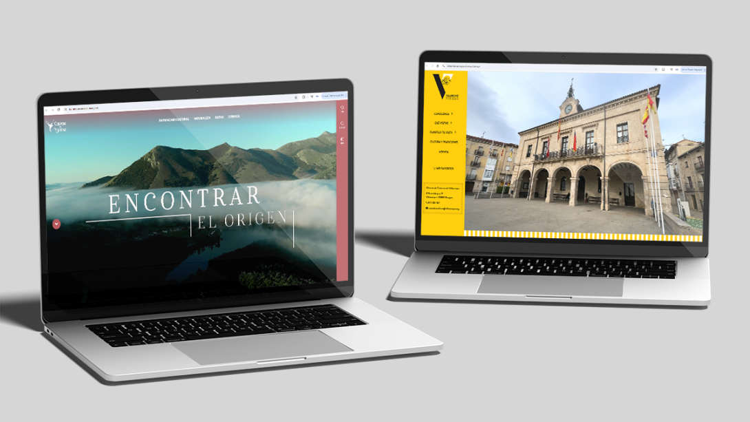 Dos ordenadores sobre fondo gris